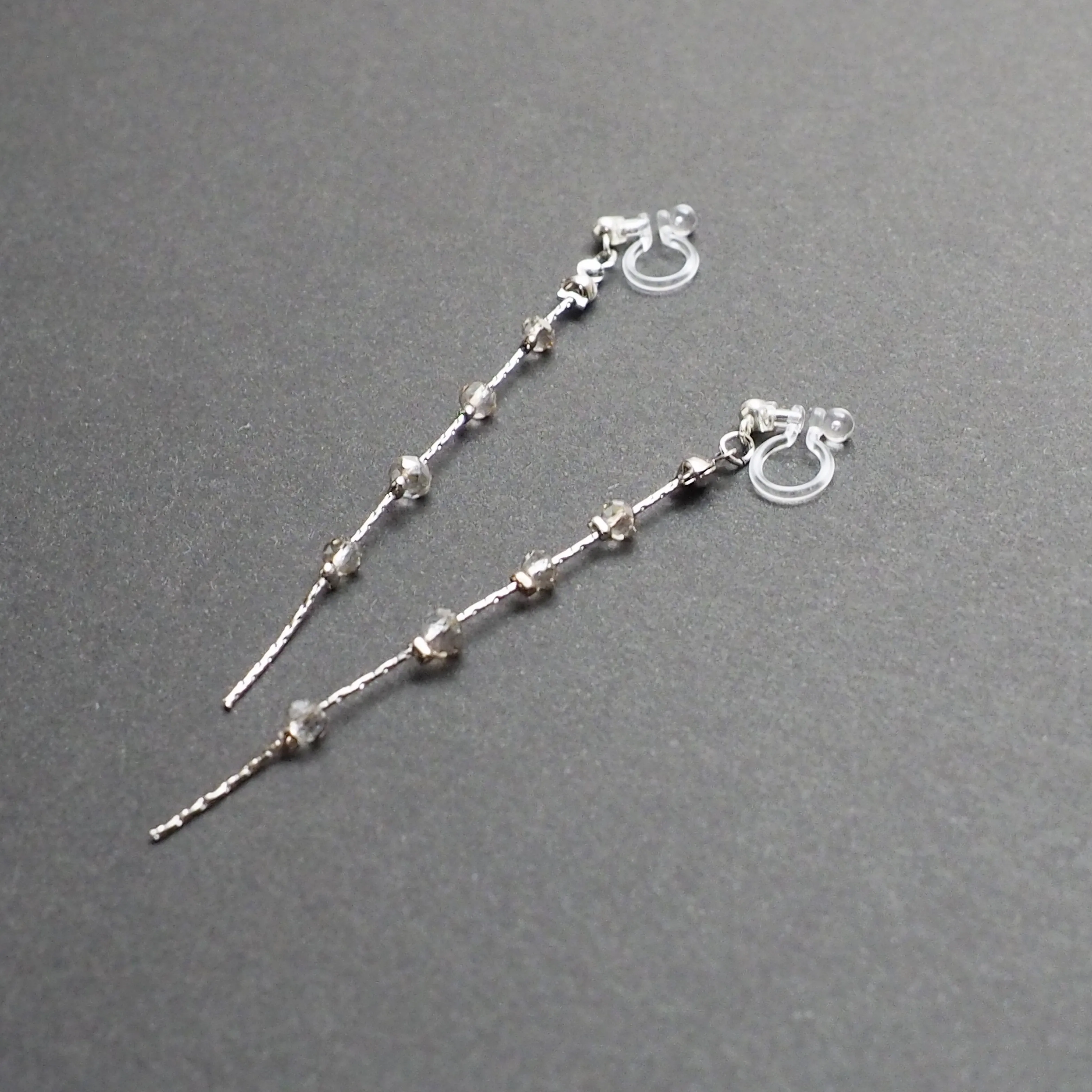 Dangle silver chain & gray crystal invisible clip on earrings