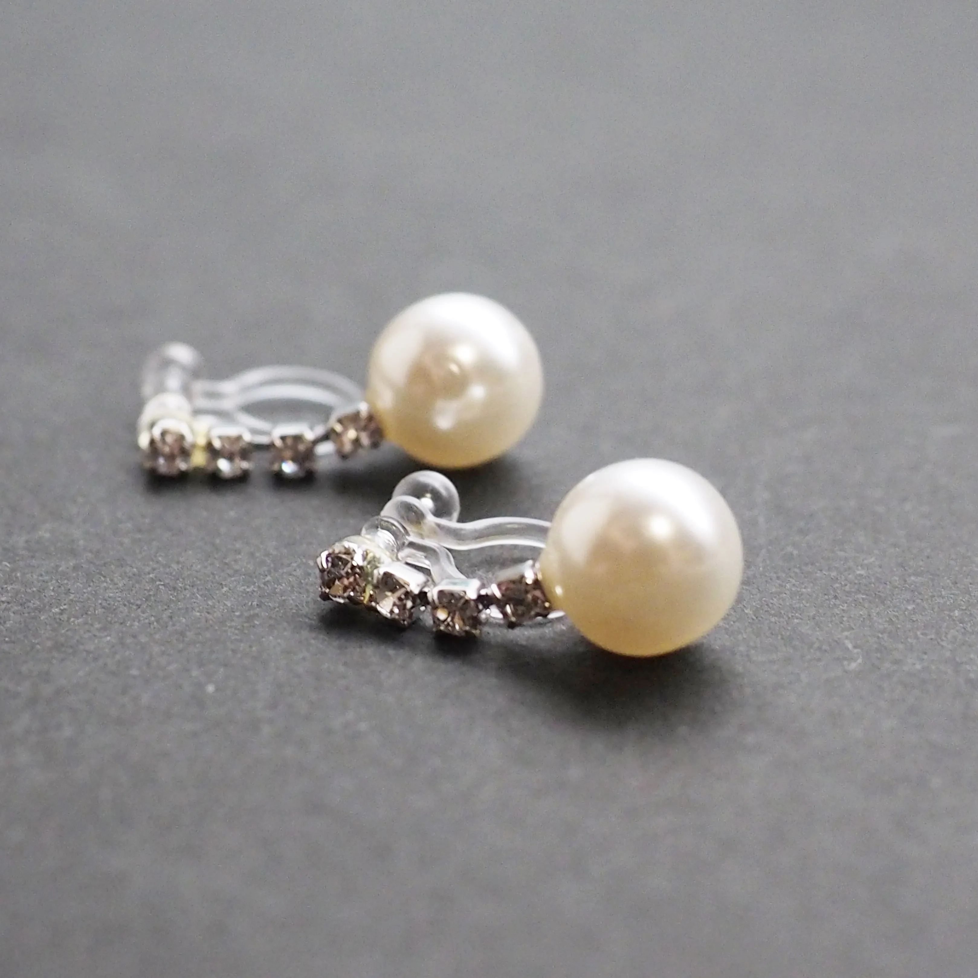 Dangle White Pearl & Crystal Invisible Clip On Earrings (Silver tone)