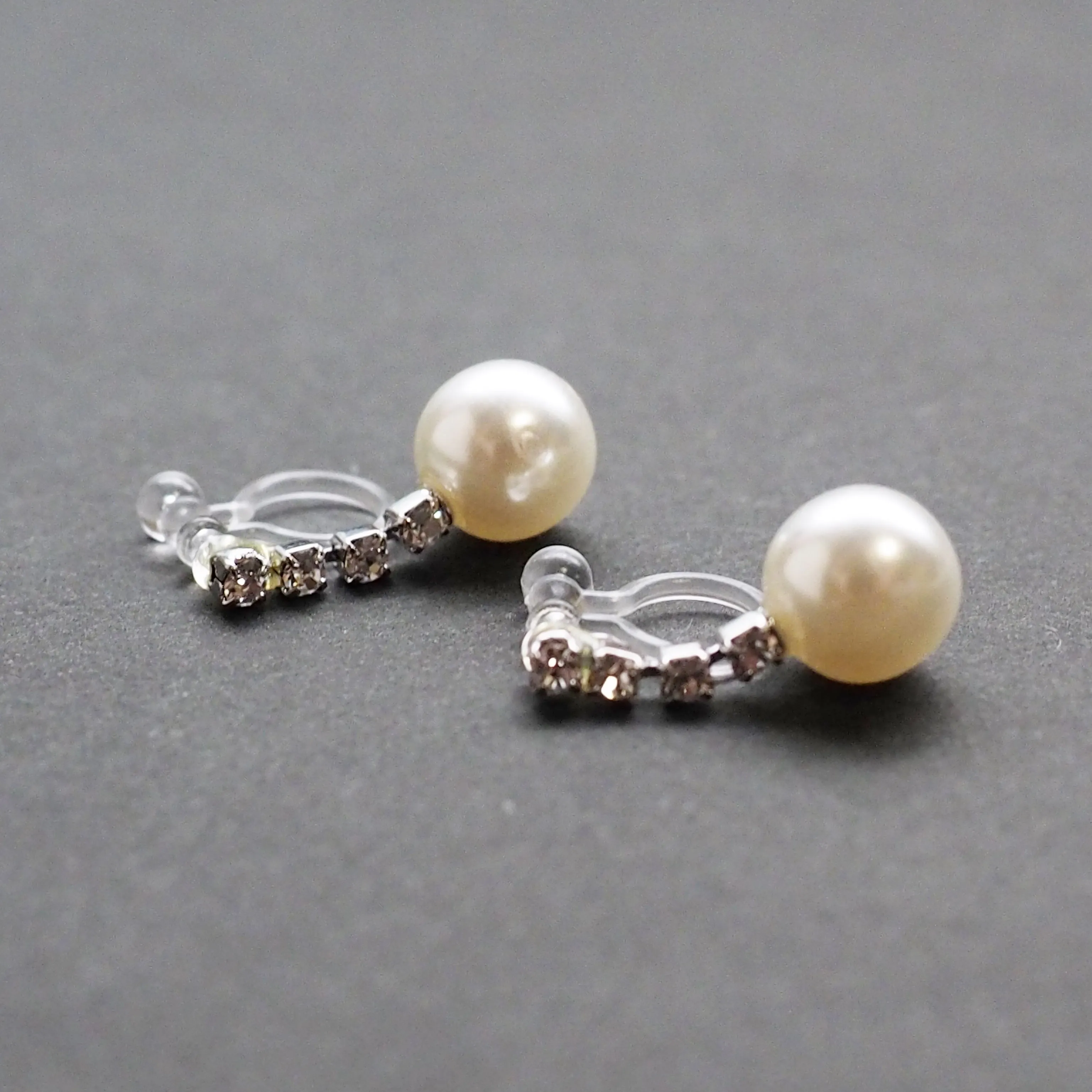 Dangle White Pearl & Crystal Invisible Clip On Earrings (Silver tone)