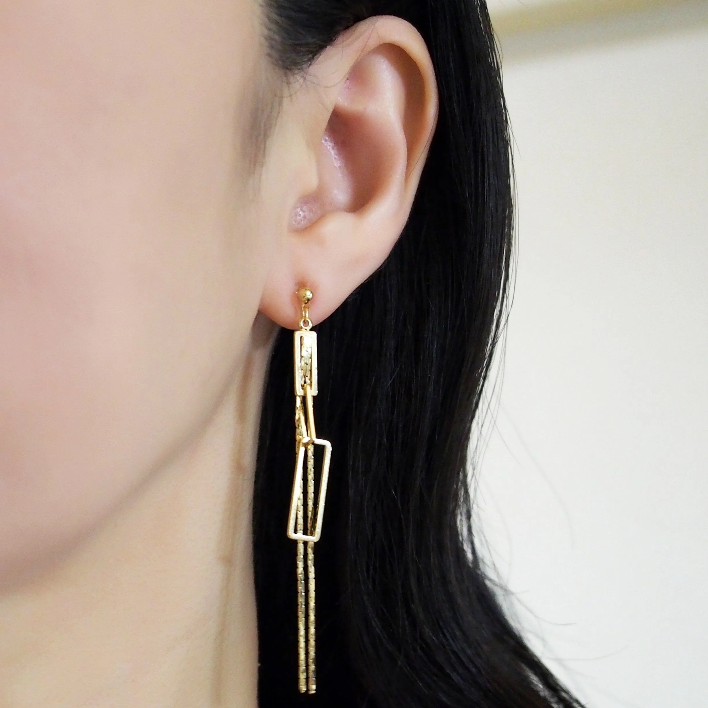 Gold chain and rectangular motif invisible clip on earrings