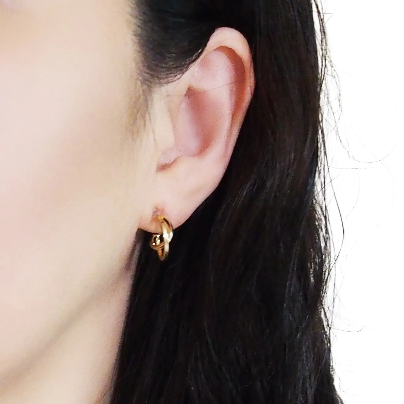 Gold Huggie Crossed Invisible Clip On Hoop Earrings