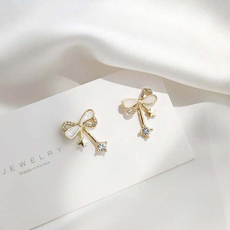 Ribbon Shaped Beige Crystal Rhinestone Bow Tie Invisible Clip On Stud Earrings