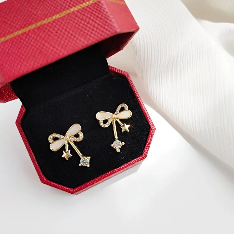 Ribbon Shaped Beige Crystal Rhinestone Bow Tie Invisible Clip On Stud Earrings